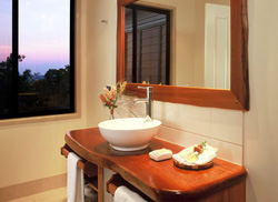 Admire the views from the modern timber bathroom